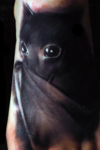 Looking for unique  Tattoos? Bat on foot